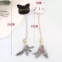 Campana con plumas para gato